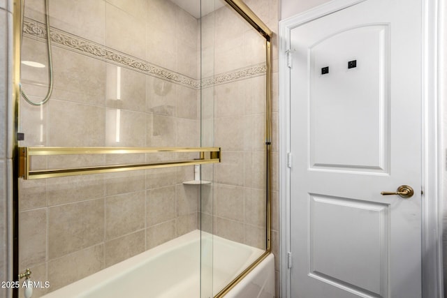 bathroom with shower / bath combination with glass door