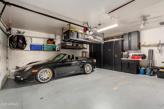 garage featuring visible vents and a ceiling fan