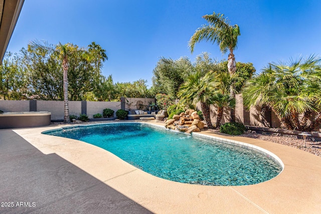 view of pool featuring a patio area, a fenced backyard, and a fenced in pool