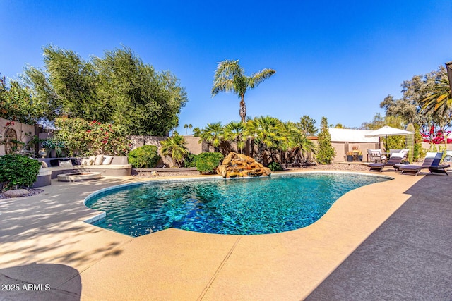 view of swimming pool with a fenced in pool, a fenced backyard, and a patio