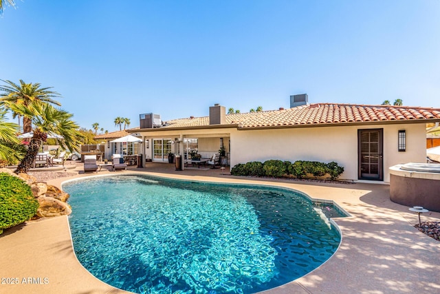 pool featuring central AC and a patio