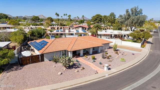 aerial view featuring a mountain view and a residential view