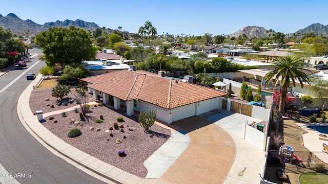 drone / aerial view featuring a residential view and a mountain view