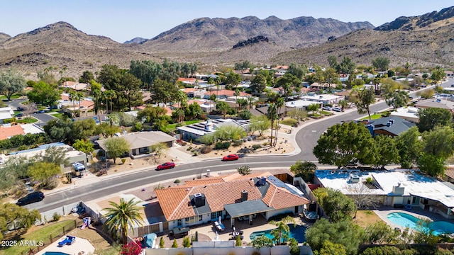 birds eye view of property with a residential view and a mountain view