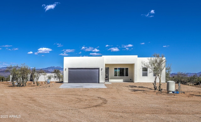16025 E Rancho Laredo Dr, Scottsdale, AZ 85262 - view of front of property with a mountain view, an attached garage, and stucco siding