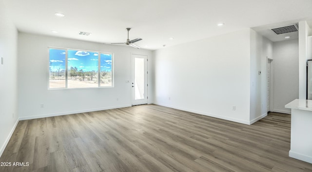 16025 E Rancho Laredo Dr, Scottsdale, AZ 85262 - unfurnished living room featuring wood finished floors, a ceiling fan, baseboards, and recessed lighting