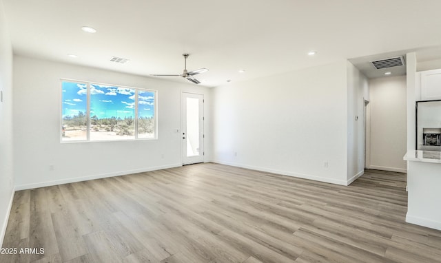 16025 E Rancho Laredo Dr, Scottsdale, AZ 85262 - unfurnished living room featuring light wood finished floors, recessed lighting, a ceiling fan, and baseboards