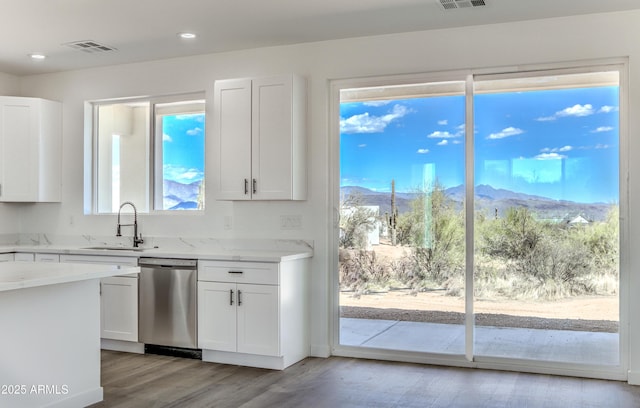 16025 E Rancho Laredo Dr, Scottsdale, AZ 85262 - kitchen with a sink, stainless steel dishwasher, a mountain view, light stone countertops, and light wood-style flooring