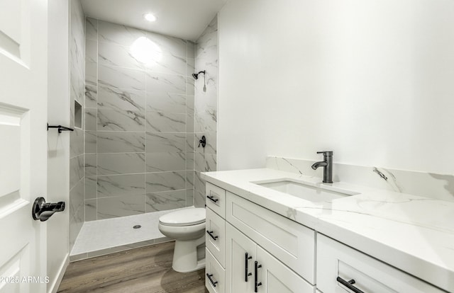 16025 E Rancho Laredo Dr, Scottsdale, AZ 85262 - full bath with a tile shower, vanity, toilet, wood finished floors, and recessed lighting