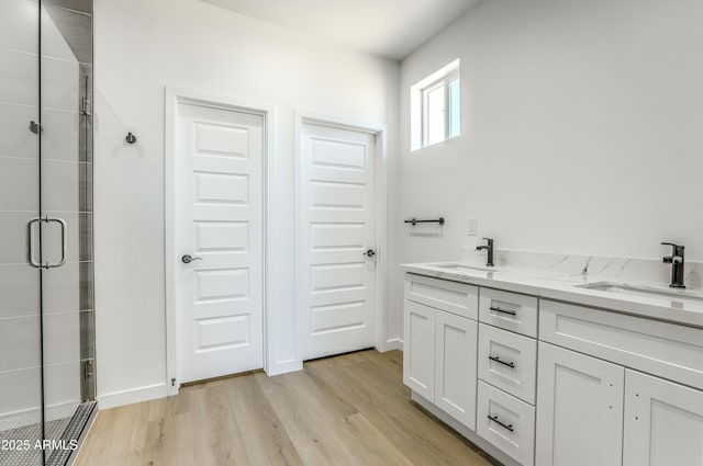 16025 E Rancho Laredo Dr, Scottsdale, AZ 85262 - full bath featuring a stall shower, wood finished floors, and double vanity