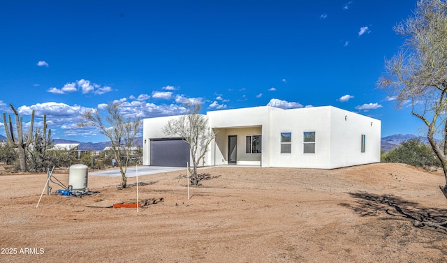 16025 E Rancho Laredo Dr, Scottsdale, AZ 85262 - view of front of property featuring a garage, concrete driveway, stucco siding, and a mountain view