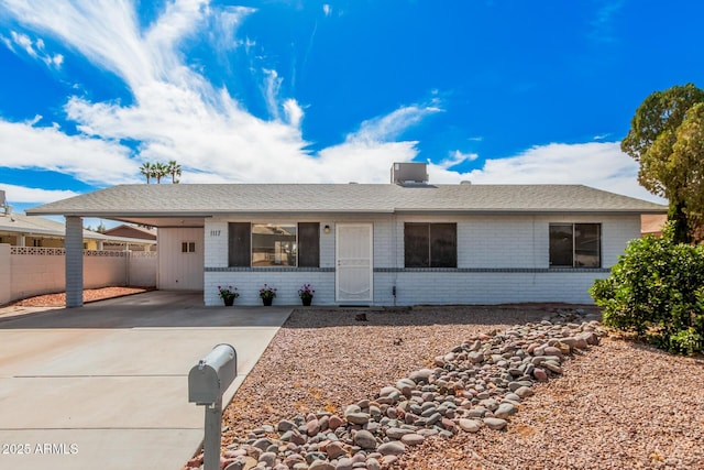 ranch-style house with a carport