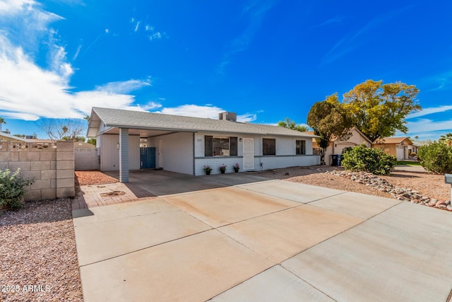 ranch-style home with a carport