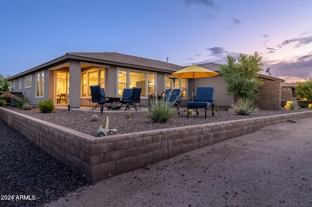 view of front of home with a patio area