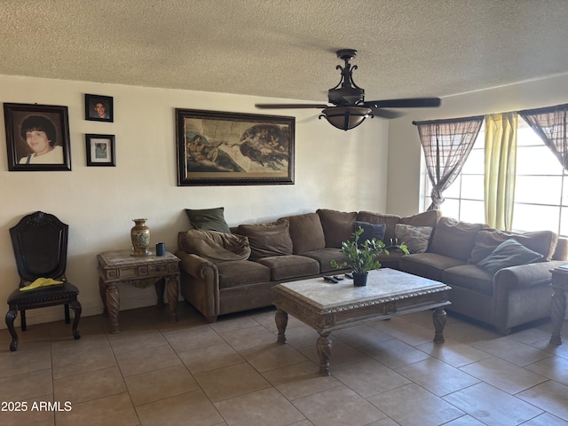 tiled living room featuring a textured ceiling and a ceiling fan