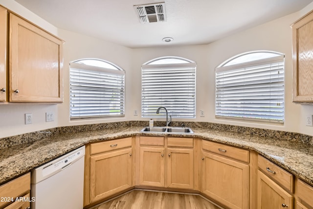 kitchen featuring dishwasher, light hardwood / wood-style flooring, plenty of natural light, and sink