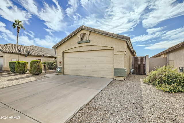 exterior space with an outdoor structure and a garage