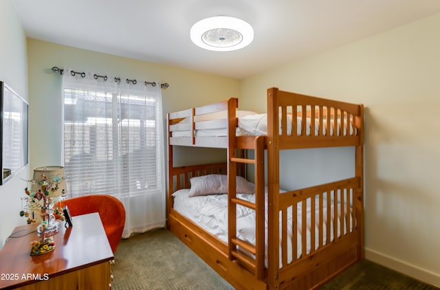 bedroom with carpet flooring and baseboards