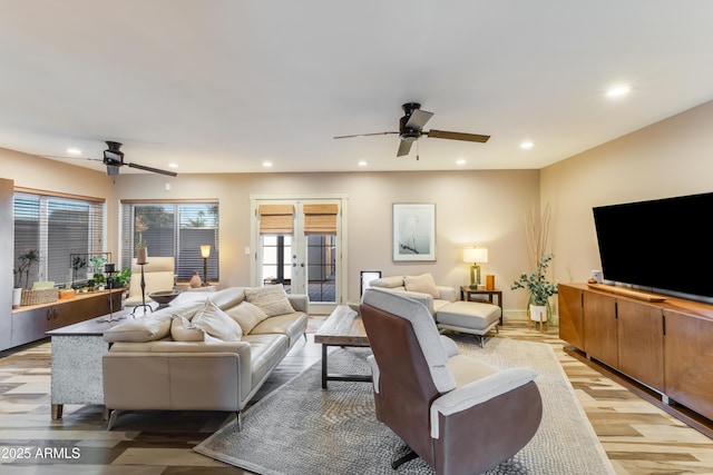 living area with recessed lighting, a ceiling fan, baseboards, french doors, and light wood finished floors