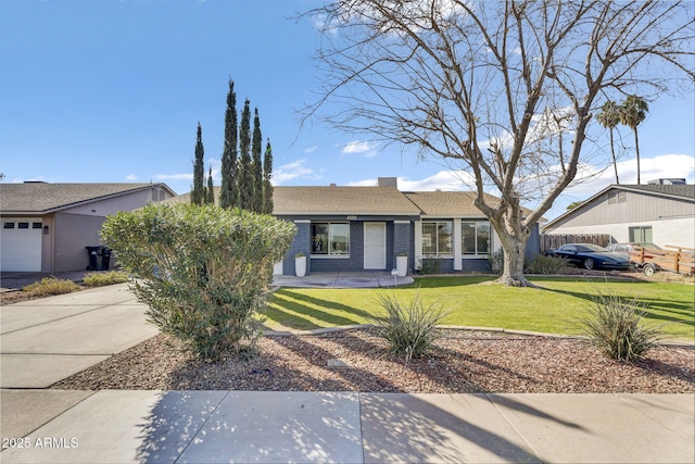 ranch-style house with concrete driveway, a front lawn, an attached garage, and brick siding