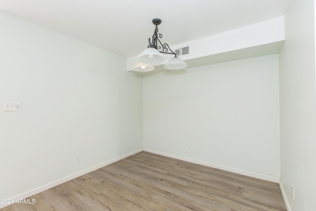 spare room with light wood-type flooring