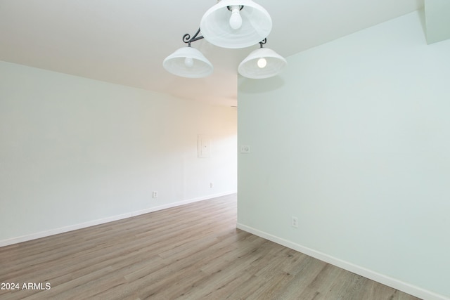 empty room with light hardwood / wood-style floors