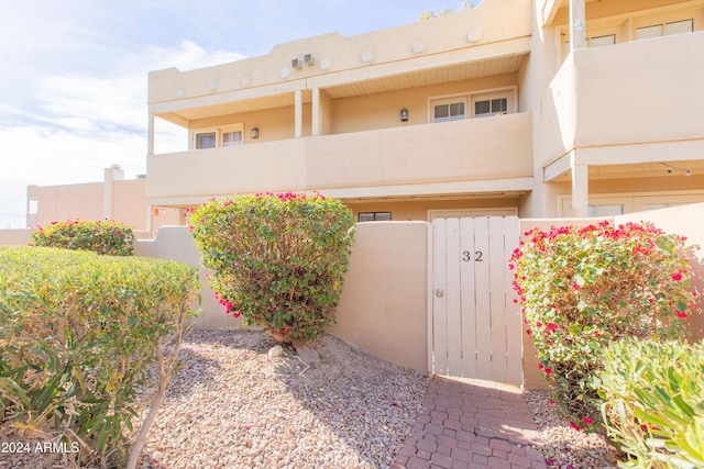 view of front of home with a balcony