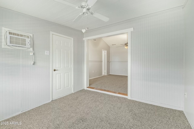 carpeted spare room with a wall mounted air conditioner and ceiling fan