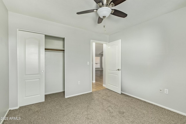 unfurnished bedroom featuring a closet, baseboards, and carpet