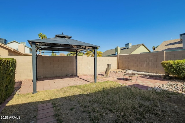 view of yard featuring a gazebo, a patio, and a fenced backyard