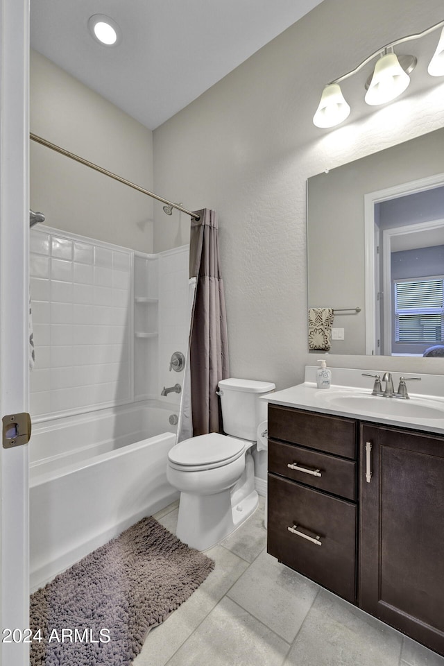 full bathroom featuring shower / tub combo, vanity, toilet, and tile patterned floors