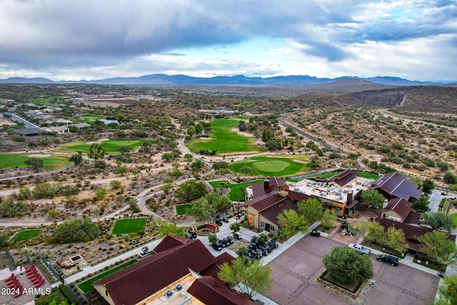 birds eye view of property with a mountain view