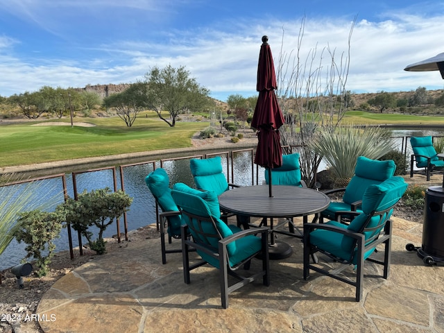 view of patio with a water view