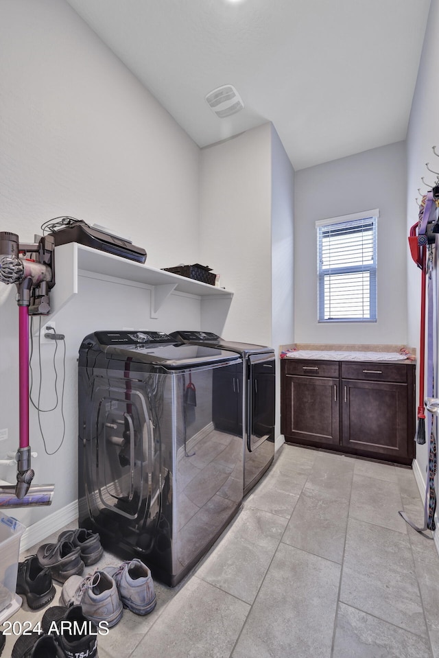 washroom with independent washer and dryer