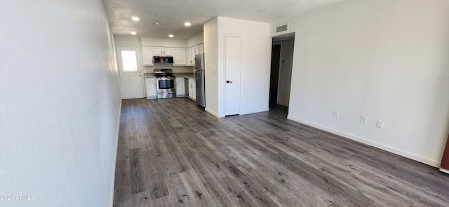 unfurnished living room with wood-type flooring