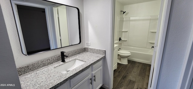 full bathroom with toilet, hardwood / wood-style flooring, shower / tub combination, and vanity