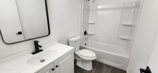 full bathroom with wood-type flooring, toilet, shower / tub combination, and vanity