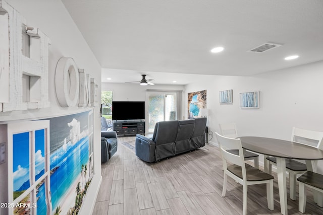 living area with recessed lighting, visible vents, a ceiling fan, and wood finish floors