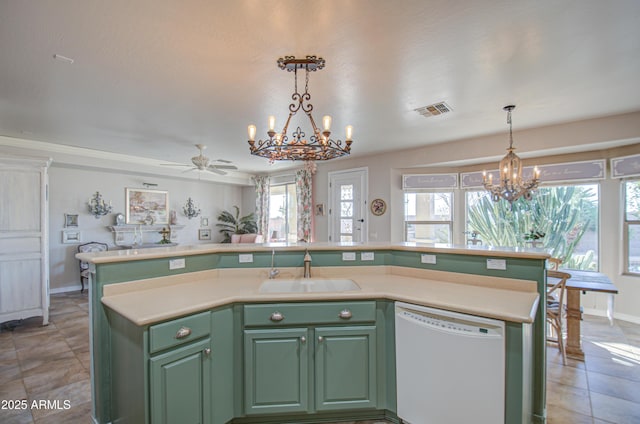 kitchen with a sink, visible vents, dishwasher, and green cabinetry