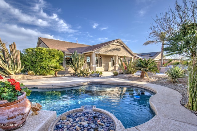 pool featuring a patio and fence