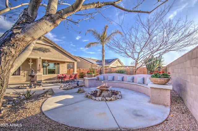 view of patio / terrace featuring a fenced backyard and an outdoor fire pit