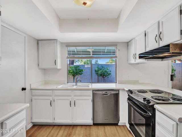 17838 N 45th Ave, Glendale, AZ 85308 - kitchen with stainless steel dishwasher, white cabinetry, a sink, black range with electric stovetop, and a tray ceiling