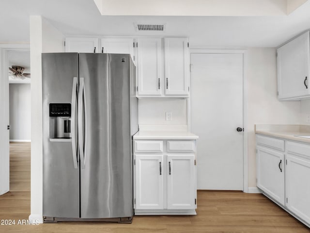 17838 N 45th Ave, Glendale, AZ 85308 - kitchen featuring stainless steel fridge, visible vents, and white cabinets