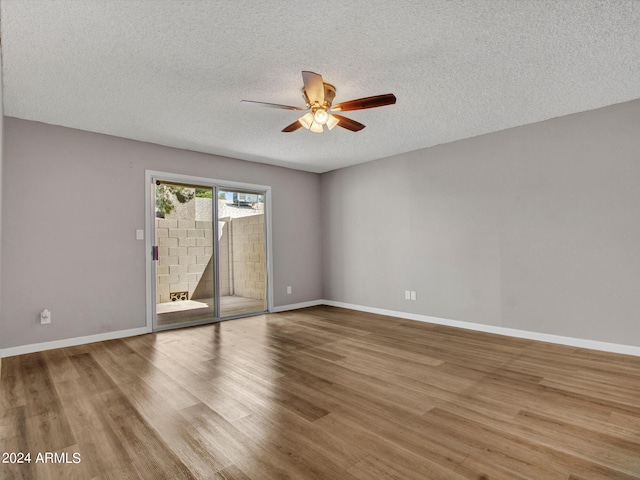 17838 N 45th Ave, Glendale, AZ 85308 - unfurnished room featuring a ceiling fan, baseboards, wood finished floors, and a textured ceiling