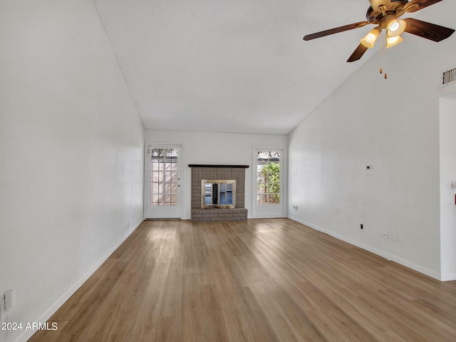 17838 N 45th Ave, Glendale, AZ 85308 - unfurnished living room featuring ceiling fan, light wood finished floors, baseboards, visible vents, and lofted ceiling