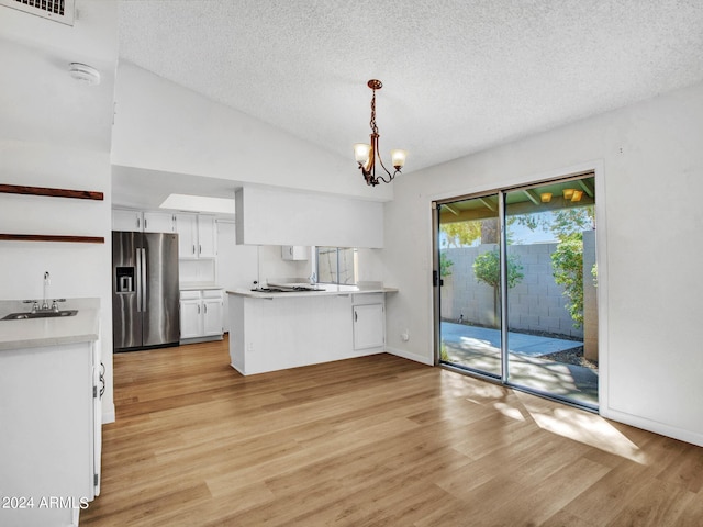 17838 N 45th Ave, Glendale, AZ 85308 - kitchen featuring a sink, stainless steel refrigerator with ice dispenser, light wood-style flooring, a peninsula, and white cabinetry