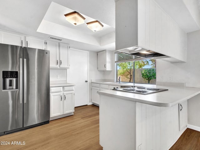 17838 N 45th Ave, Glendale, AZ 85308 - kitchen with electric cooktop, stainless steel fridge, light wood-type flooring, visible vents, and a peninsula