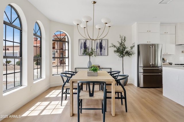 14401 N 60th Pl, Scottsdale, AZ 85254 - dining room with light wood-type flooring and a chandelier