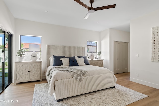 14401 N 60th Pl, Scottsdale, AZ 85254 - bedroom with light wood finished floors, access to outside, and a ceiling fan