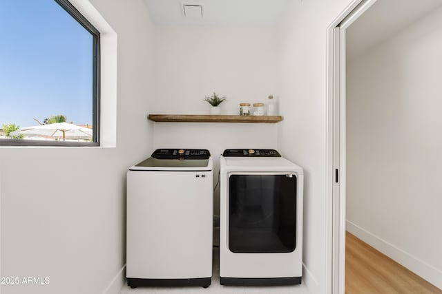 14401 N 60th Pl, Scottsdale, AZ 85254 - laundry room with washer and clothes dryer and wood finished floors